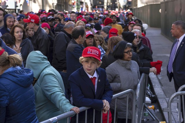 Supporters of Republican presidential nominee former President Donald Trump gather for his campaign rally outside Madison Square Garden, Sunday, October 27, 2024, in New York. (Photo by Yuki Iwamura/AP Photo)