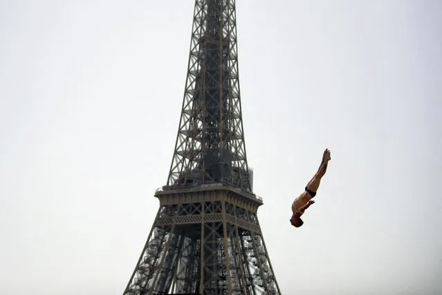 France's Gary Hunt takes a practice dive during the Red Bull Cliff Diving World Series near the Eiffel Tower in Paris, on June 18, 2022. (Photo by Julien de Rosa/AFP Photo)