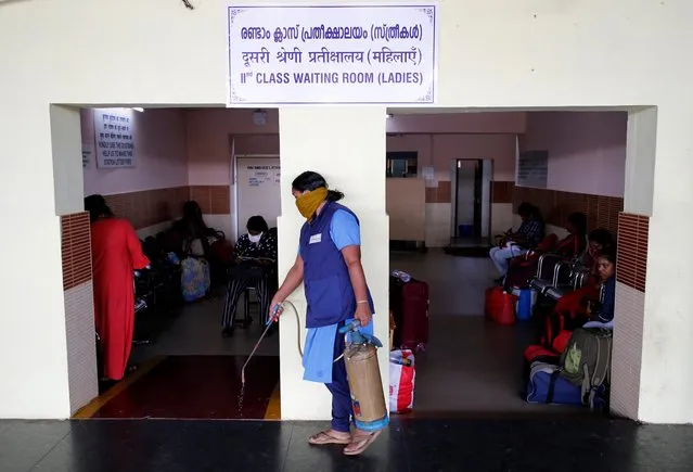 A railway staff sprays disinfectant outside a waiting room at a railway station as a preventive measure against coronavirus, in Kochi, India, March 15, 2020. (Photo by Sivaram V/Reuters)