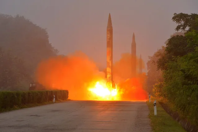 Ballistic rocket is seen launching during a drill by the Hwasong artillery units of the KPA Strategic Force in this undated picture provided by KCNA in Pyongyang on July 21, 2016. (Photo by Reuters/KCNA)