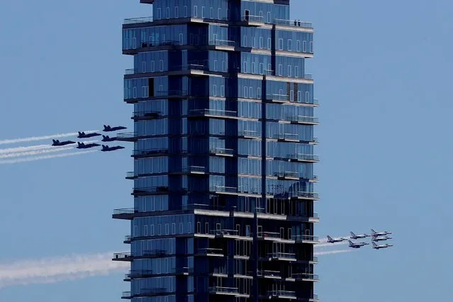 U.S. Navy Blue Angels and U.S. Air Force Thunderbirds demonstration teams participate in a midday flyover of the New York City region as part of the “America Strong” tour of U.S. cities to honor first responders and essential workers April 28, 2020. (Photo by Mike Segar/Reuters)