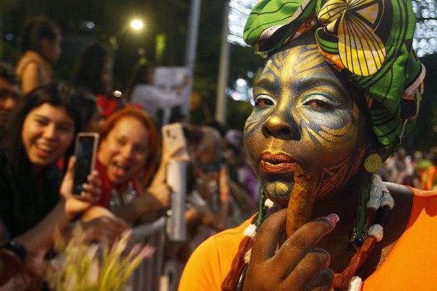 Artists participate in the traditional Parade of Myths, Legends, Carnivals and Ancestral Manifestations of Colombia, in Medellin, Colombia 08 December 2023. The parade highlights local legends like El Dorado, typical Colombian celebrations such as the Barranquilla Carnival, and recalls beliefs about ancient pre-Hispanic gods, in a colorful and cultural route that remembers and exalts the folklore and cosmogony of Colombia. (Photo by Luis Eduardo Noriega Arboleda/EPA)