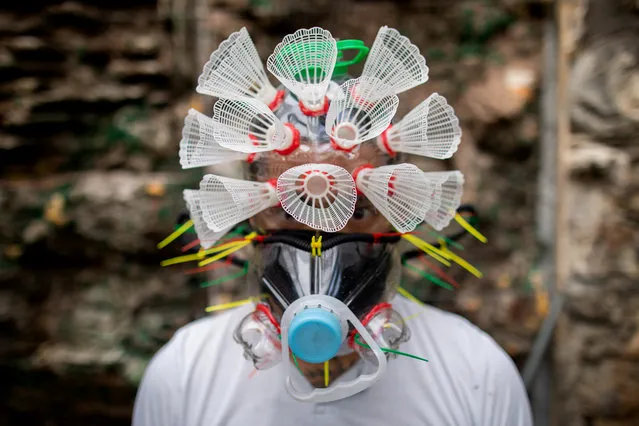 Filipino artist Leeroy New poses with a makeshift mask he designed with recycled materials as he adapts to the effects of the coronavirus disease (COVID-19) pandemic in the art industry, in his studio in Quezon City, Metro Manila, Philippines, May 28, 2020. (Photo by Eloisa Lopez/Reuters)