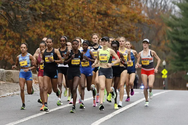 Eventual women's winner Viola Chepngeno of Kenya, center, leads a pack of elite women runners including Molly Seidel (in green) of the United States during the Boston Half Marathon on November 13, 2022 in Boston, Massachusetts. (Photo By Winslow Townson/Getty Images)