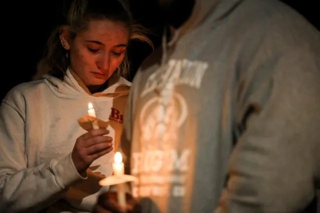 People attend a vigil after a mass shooting at the Club Q gay nightclub in Colorado Springs, Colorado, U.S., November 20, 2022. (Photo by Kevin Mohatt/Reuters)