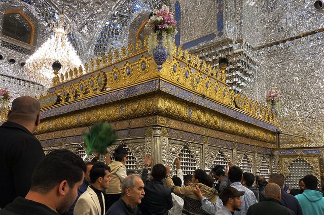 Shiite worshippers gather at the golden-domed shrine of Imam Moussa al-Kadhim, who died at the end of the eighth century, during holy fasting month of Ramadan, in Baghdad, Iraq, Tuesday, March 4, 2025. (Photo by Hadi Mizban/AP Photo)