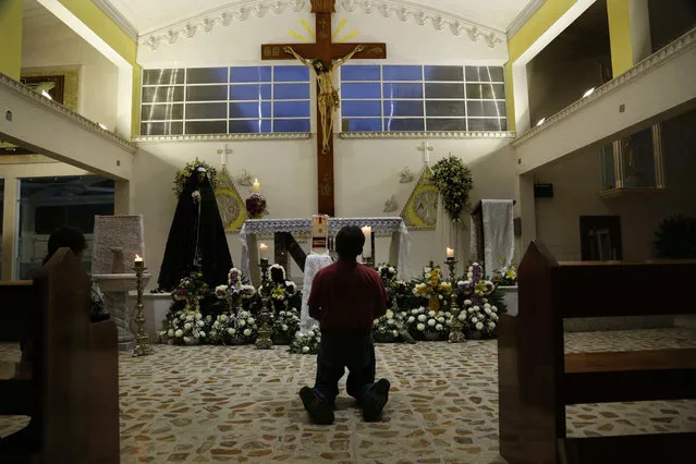 A person prays in Our Lady of Fatima Church in Poza Rica, Veracruz state, Mexico, Tuesday, September 20, 2016. Two of the church's priests were found dead on Monday, and were last seen Sunday. Their bullet-ridden bodies were found on a roadside. (Photo by Marco Ugarte/AP Photo)