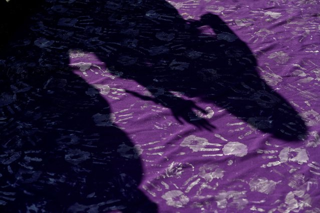 The shadows of women are seen during a protest to mark International Women's Day in Mexico City, on March 8, 2025. (Photo by Mahe Elipe/Reuters)