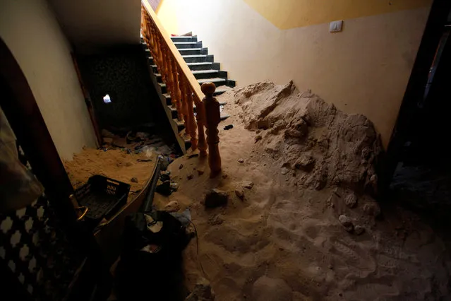 A staircase, that was used by Islamic State militants as a hideout, is seen after it was captured by Libyan forces allied with the U.N.-backed government and Islamic State militants, in neighborhood Number Three in Sirte, Libya, October 10, 2016. (Photo by Ismail Zitouny/Reuters)