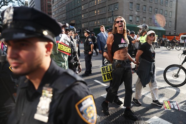 Protesters are detained for attempting to block traffic at the intersection of 42nd street during the 80th session of the United Nations General Assembly in New York, Tuesday, September 23, 2025. (Photo by Heather Khalifa/AP Photo)
