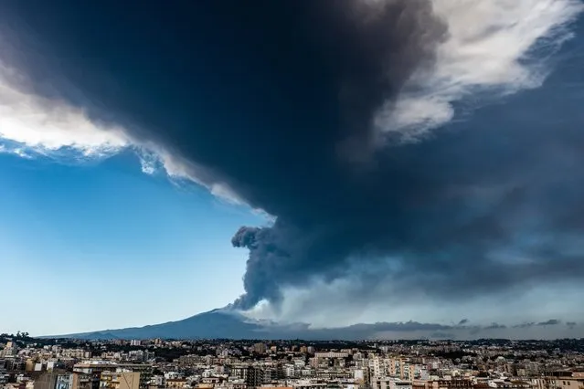 Aerial view of the Etna volcano eruption seen from the city of Catania with a 10 km high ash cloud on February 21, 2022 in Catania, Italy. A new eruption of Etna with lava fountains over the top of the volcano reaching a height of 10 thousand metres. The winds disperse the pyroclastic material and black sand towards the south east. This is the second eruptive episode in 2022. (Photo by Fabrizio Villa/Getty Images)
