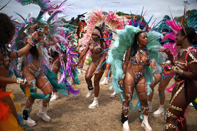 Members of the Notting Hill Carnival perform on the third day of the Glastonbury festival at Worthy Farm in the village of Pilton in Somerset, southwest England, on June 28, 2024. The festival takes place from June 26 to June 30. (Photo by Oli Scarff/AFP Photo)