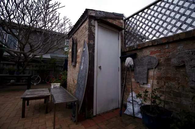 A surfboard rests against an old toilet shed, also known in Australia as a 'dunny' or an 'outhouse', in the backyard of a home in the northern beaches suburb of Manly in Sydney, Australia, October 8, 2015. (Photo by David Gray/Reuters)