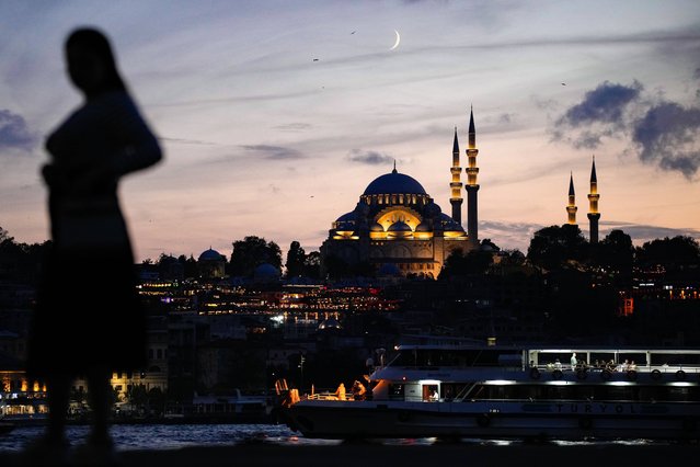 The crescent moon rises behind the Suleymaniye mosque in Istanbul, Turkey, Thursday, September 25, 2025. (Photo by Emrah Gurel/AP Photo)