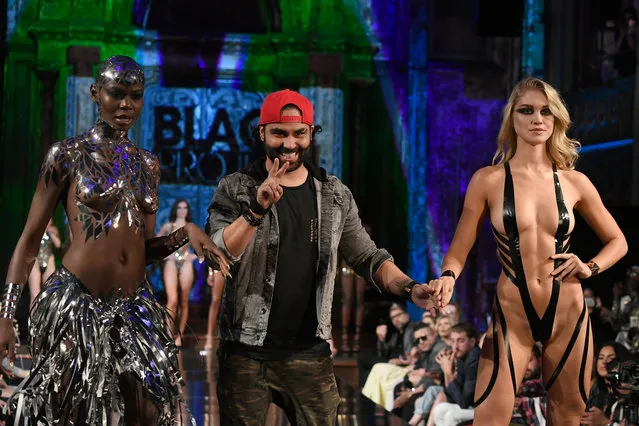 Black Tape Project fashion designer Joel Alvarez walks the runway with a model during the Black Tape Project show at New York Fashion Week Powered By Art Hearts Fashion at The Angel Orensanz Foundation on September 9, 2018 in New York City. (Photo by Arun Nevader/Getty Images for Art Hearts Fashion)