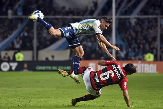 Ayrton Lucas of Brazil's Flamengo, right, is fouled by Gabriel Hauche of Argentina's Racing Club during a Copa Libertadores group A soccer match at Presidente Peron stadium in Avellaneda, Argentina, Thursday, May 4, 2023. (Photo by Gustavo Garello/AP Photo)