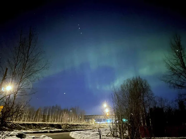 The northern lights are visible over Anchorage, Alaska, early Wednesday, April 19, 2023. (Photo by Mark Thiessen/AP Photo)