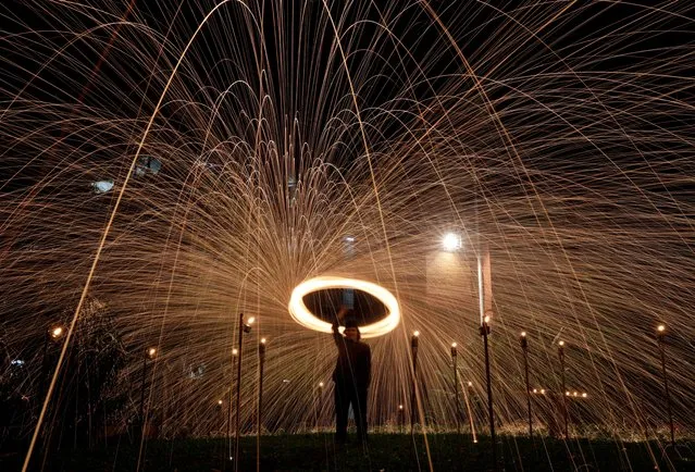 Malaysian Muslim Fadzlie Mohamad, 38, swings a sparkler on the last ten days of Muslim holy month of Ramadan in Kuala Lumpur, Malaysia on April 16, 2023. (Photo by Hasnoor Hussain/Reuters)