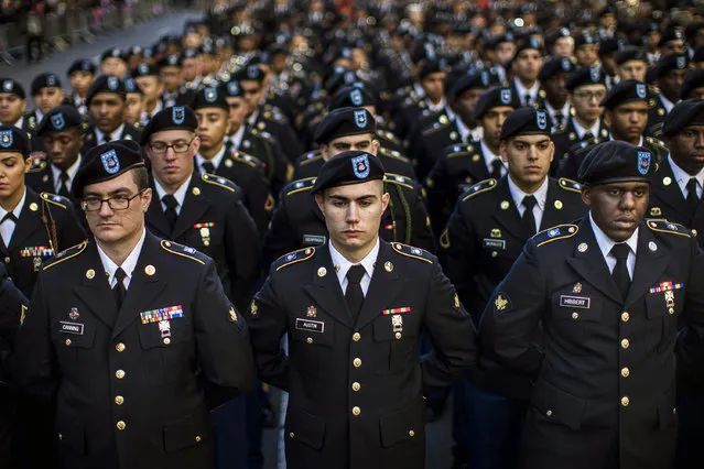 Military personnel march in the annual Veteran's Day parade in New York, Friday, November 11, 2016. (Photo by Andres Kudacki/AP Photo)