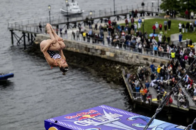 In this handout image provided by Red Bull, Jessica Macaulay of Canada dives from the 21-metre platform on the Institute of Contemporary Art during the final competition day of the first stop of the Red Bull Cliff Diving World Series on June 03, 2023 at Boston, Massachusetts. (Photo by Dean Treml/Red Bull via Getty Images)