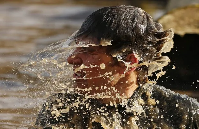 A competitor shakes water off his head  during the Tough Guy event in Perton, central England February 1, 2015. (Photo by Phil Noble/Reuters)