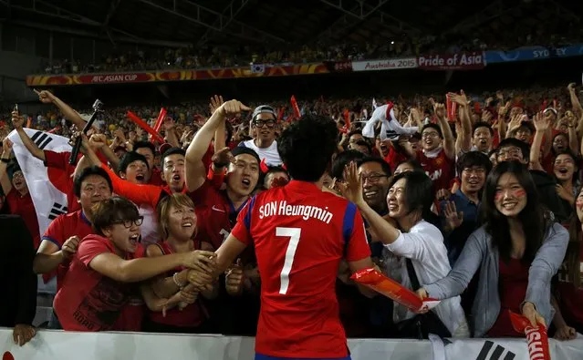 South Korea's Son Heung-min celebrates with fans after scoring a goal against Australia during their Asian Cup final soccer match at the Stadium Australia in Sydney January 31, 2015. (Photo by Jason Reed/Reuters)