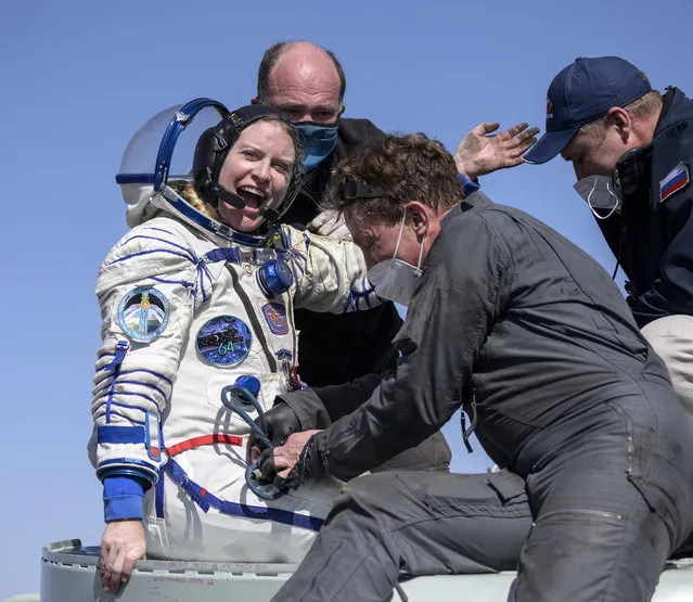 Expedition 64 NASA astronaut Kate Rubins is helped out of the Soyuz MS-17 spacecraft just minutes after she, and Roscosmos cosmonauts Sergey Kud-Sverchkov and Sergey Ryzhikov landed in a remote area near the town of Zhezkazgan, Kazakhstan on Saturday, April 17, 2021. (Photo by Bill Ingalls/NASA via AP Photo)
