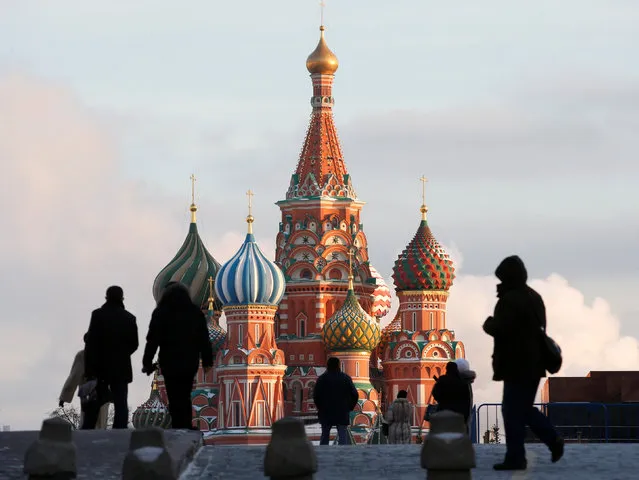 People walk in Red Square, with St. Basil's Cathedral seen in the background, in central Moscow, Russia, February 6, 2015. (Photo by Maxim Zmeyev/Reuters)