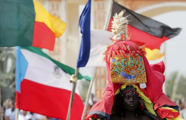 A devotee dances during the annual voodoo festival in Ouidah in Benin, January 10, 2016. (Photo by Akintunde Akinleye/Reuters)