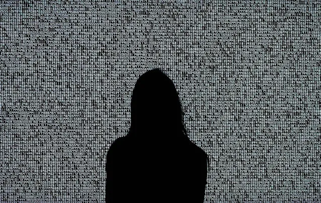 A woman looks at a NFT by Ryoji Ikeda titled “A Single Number That Has 10,000,086 Digits” during a media preview on June 4, 2021, at Sotheby's for the Natively Digital: A Curated NFT Sale Online Auction to take place June 10, 2021. They are technology enthusiasts on the hunt for opportunities in the Wild West market surrounding NFTs: the popular certified digital objects that have spawned a new generation of collectors convinced of their huge potential. (Photo by Timothy A Clary/AFP Photo)