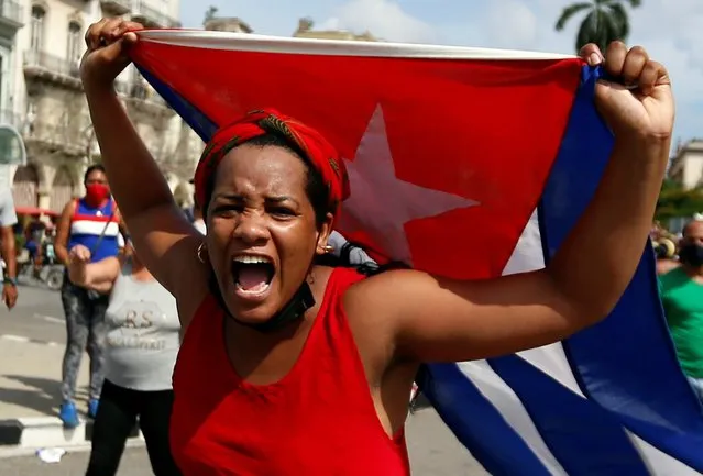 A woman shouts during a pro-government rally in Havana, Cuba, 11 July 2021. Cuban President Miguel Diaz-Canel encouraged his supporters to take the streets as a response to protest against his governement. Thousands of Cuban took the streets on 11 July to protest against Cuba's government, in what is considered the first major protest in the last 60 years. (Photo by Ernesto Mastrascusa/EPA/EFE)