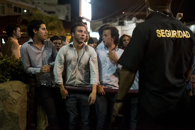 Clubgoers wait in line in front of Baby O nightclub on April 2, 2015 in Acapulco, Mexico. (Photo by Jonathan Levinson/The Washington Post)