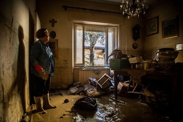 A woman inspects her devastated home after flooding devastated the Marche region, Senigallia, Italy on September 18, 2022. (Photo by Alessandro Serrano/Rex Features/Shutterstock)