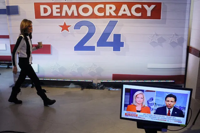 Nikki Haley walks off the Fox News Sunday set past a monitor showing Ron DeSantis ahead of the Iowa caucus vote in Des Moines, Iowa on January 14, 2024. (Photo by Brian Snyder/Reuters)