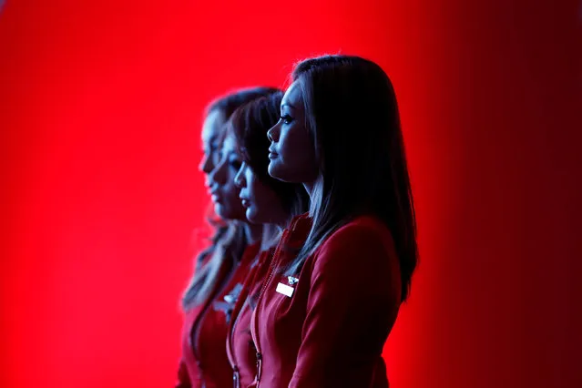 Flight attendants of the long-haul carrier AirAsia X watch a performance during the launch of the company's prospectus in Kuala Lumpur June 10, 2013. (Photo by Bazuki Muhammad/Reuters)