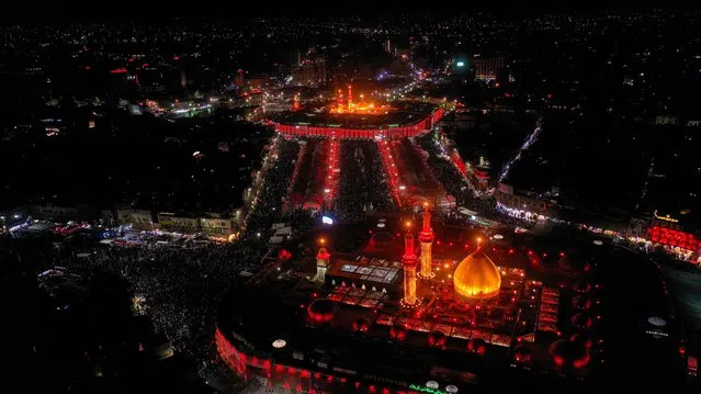 An aerial view shows the shrines of Imam al-Abbas and Imam al-Hussein ahead of the holy Shi'ite ritual of Arbaeen in Kerbala, Iraq, September 26, 2021. Picture taken with a drone. (Photo by Abdullah Dhiaa Al-Deen/Reuters)