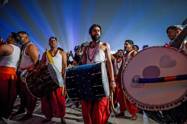 Devotees take part in a religious procession on the banks of Saryu river ahead of the Inauguration of the Ram Mandir Temple on January 20, 2024 in Ayodhya, India. The Ram Mandir, built at a site thought to be the birth place of Lord Rama, a significant figure in Hindu religion, will be inaugurated on January 22nd. (Photo by Ritesh Shukla/Getty Images)