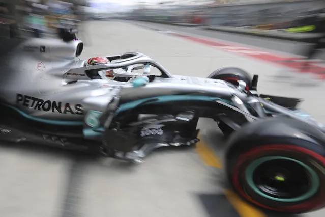 Mercedes driver Lewis Hamilton of Britain steers out of the garage during the first practice session of the Chinese Formula One Grand Prix at the Shanghai International Circuit in Shanghai on Friday, April 12, 2019. (Photo by Ng Han Guan/AP Photo)