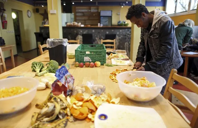 A migrant from Eritrea prepares dinner at the community centre “SPIKE Dresden” in Dresden, Germany, March 22, 2016. (Photo by Ina Fassbender/Reuters)