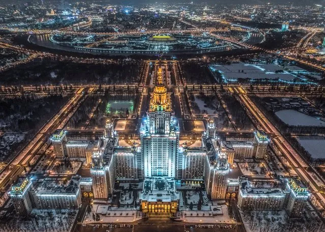 An aerial view taken with a drone in Moscow on January 27, 2018 shows the main building of the Moscow State University, Luzhniki Stadium and the Moskva River. (Photo by Dmitry Serebryakov/AFP Photo)