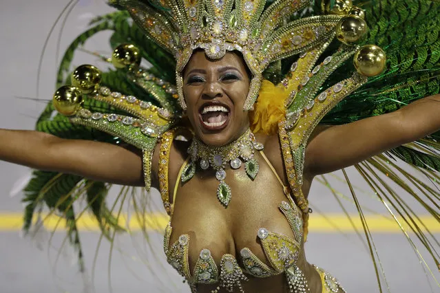 A dancer from the Tom Maior samba school performs during a carnival parade in Sao Paulo, Brazil, Friday, February 24, 2017. (Photo by Andre Penner/AP Photo)