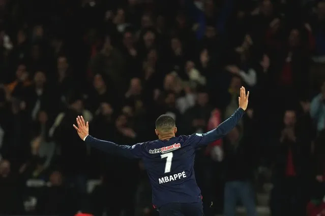 PSG's Kylian Mbappe celebrates after scoring his side's opening goal during the French Cup semifinal soccer match between Paris Saint-Germain and Rennes at the Parc des Princes stadium in Paris, France, Wednesday, April 3, 2024. (Photo by Thibault Camus/AP Photo)