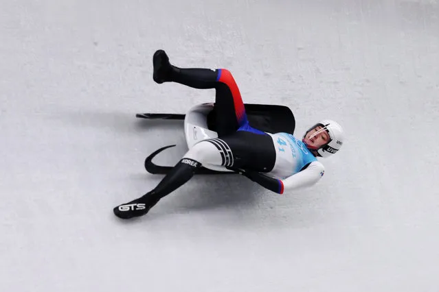 Aileen Christina Frisch of Team South Korea holds onto their luge as they slide during the Luge Team Relay on day six of the Beijing 2022 Winter Olympics at National Sliding Centre on February 10, 2022 in Yanqing, China. (Photo by Julian Finney/Getty Images)