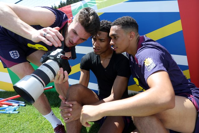 Declan Rice, Jude Bellingham and Trent Alexander-Arnold of England look at a camera during a training session at Spa & Golf Resort Weimarer Land on June 18, 2024 in Blankenhain, Germany. (Photo by Eddie Keogh – The FA/The FA via Getty Images)