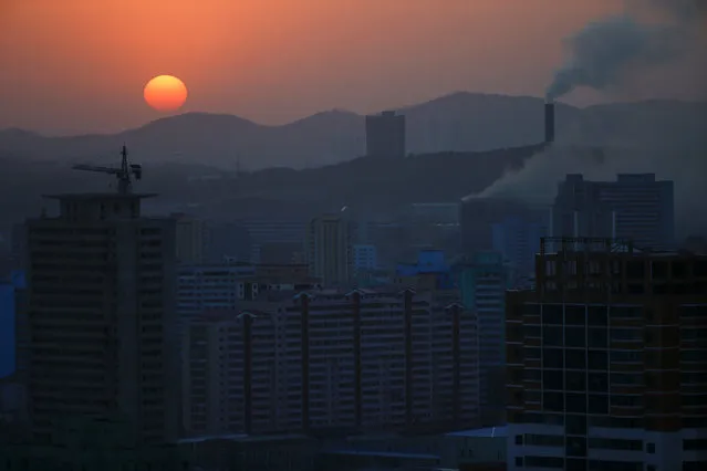 The sun set in Pyongyang, North Korea April 12, 2017. (Photo by Damir Sagolj/Reuters)
