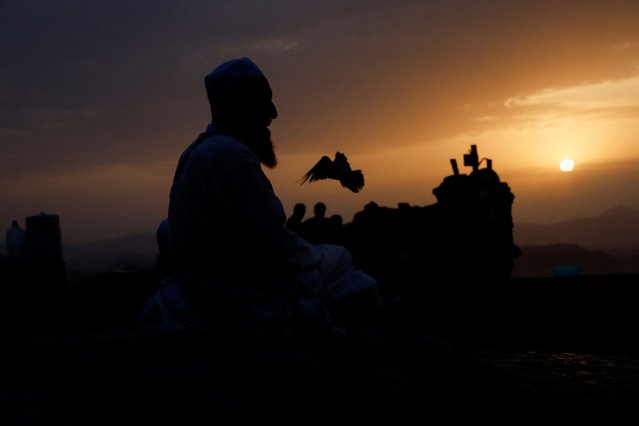 Muslim pilgrims visit Mount Al-Noor, where Muslims believe Prophet Mohammad received the first words of the Koran through Gabriel in the Hira cave, ahead of the annual haj pilgrimage in the holy city of Mecca, Saudi Arabia, on June 11, 2024. (Photo by Mohammed Torokman/Reuters)