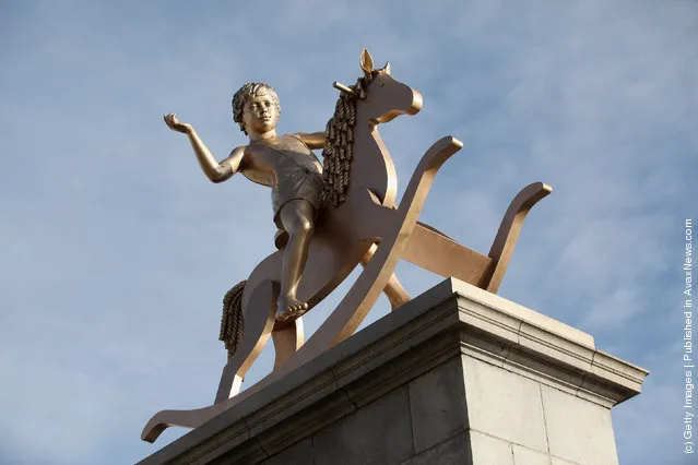 A sculpture entitled 'Powerless Structures, Fig.101' designed by Danish artist Michael Elmgreen and Norwegian artist Ingar Dragset is unveiled on the Fourth Plinth in Trafalgar Square