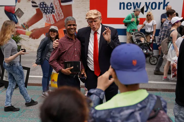 A U.S. President Donald Trump impersonator poses for photos for tips in Times Square in the Manhattan borough of New York City, New York, U.S. May 28, 2017. (Photo by Carlo Allegri/Reuters)
