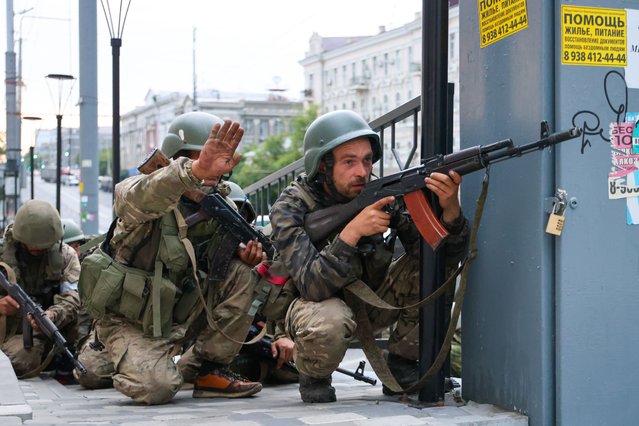 Servicemen stand outside the Southern Military District headquarters in Rostov-On-Don, Russia on June 24, 2023. (Photo by Erik Romanenko/TASS)