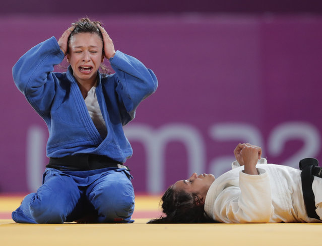 Chile's Mary Dee Vargas (L) reacts after defeating Brazil's Larissa Farias compete in their Judo Women's –48 kg Bronze Medal contest during the Lima 2019 Pan-American Games in Lima on August 8, 2019. (Photo by Guadalupe Pardo/Reuters)